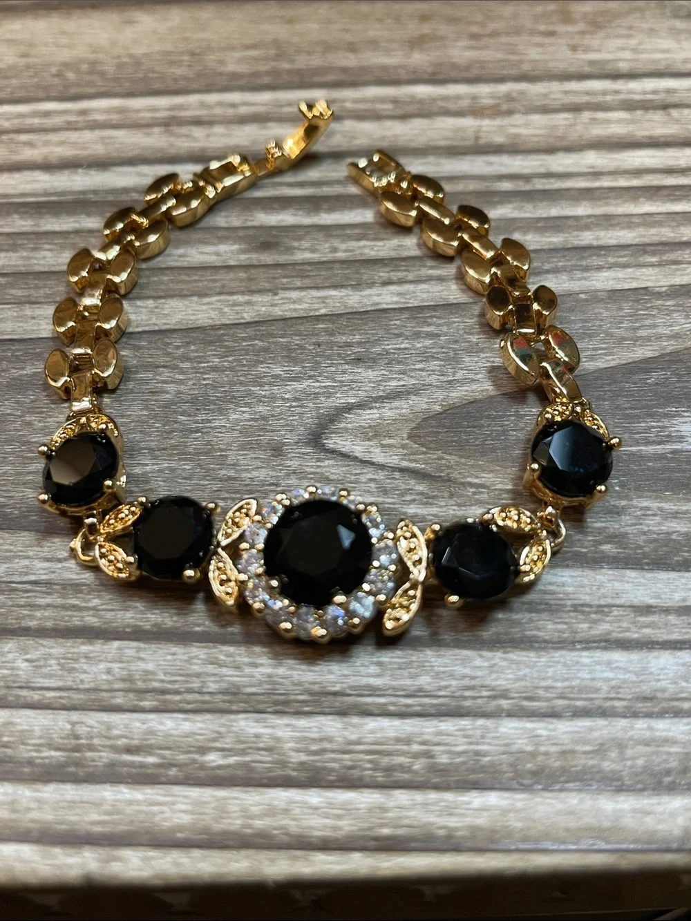 Gold-Tone Bracelet with Black Glass Gemstones and Clear Accents